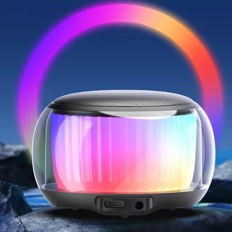 اسپیکر LED دار مدل SW102 از نمای رو به رو با LED روشن و پشت زمینه ی آبی تیره و نیم دایره ای از طیف رنگی